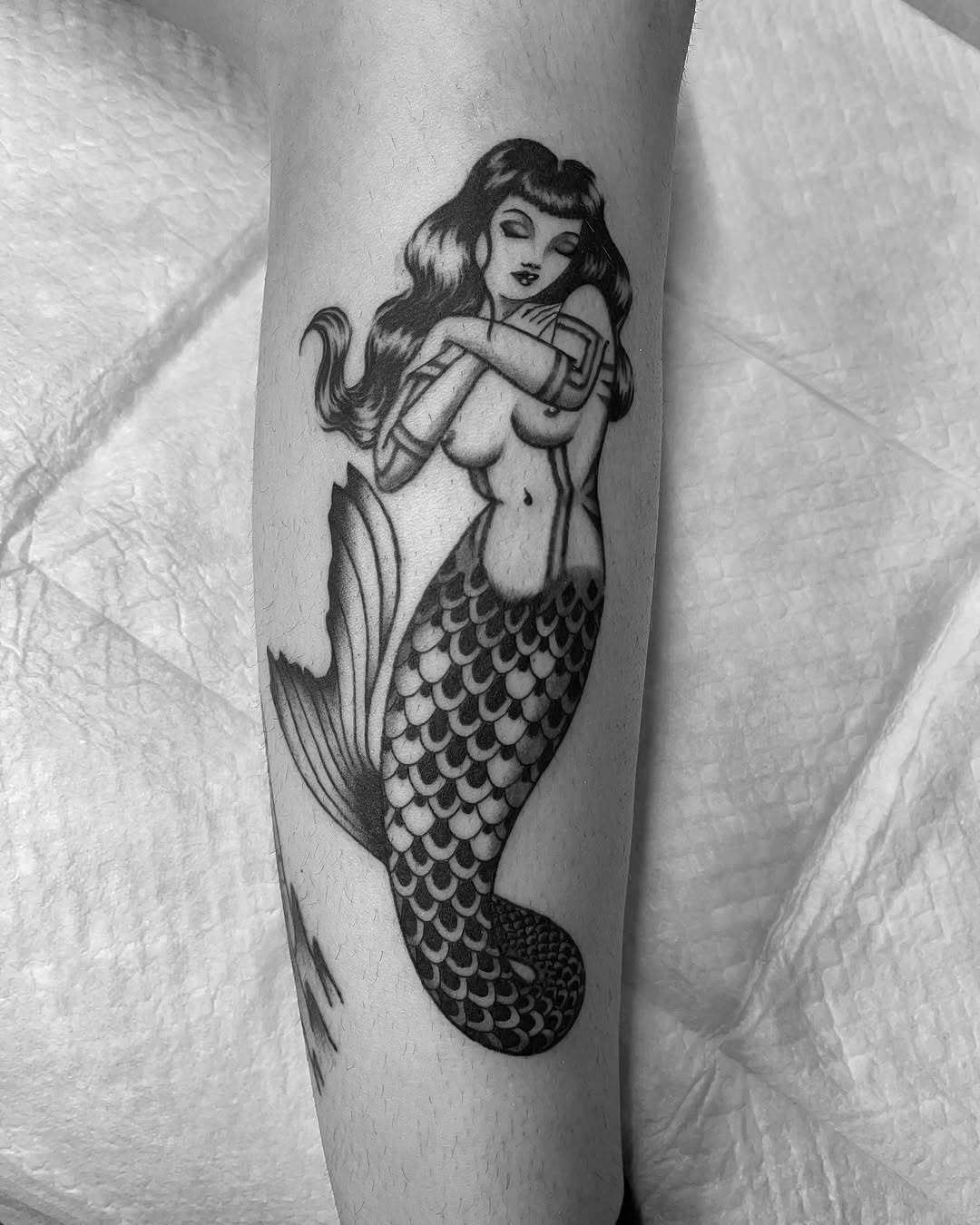 Classic mermaid tattoo with vintage vibes