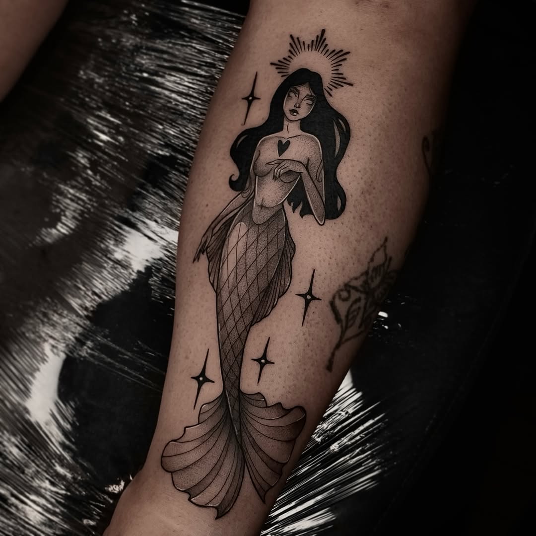 Elegant Mermaid Tattoo with Stellar Accents