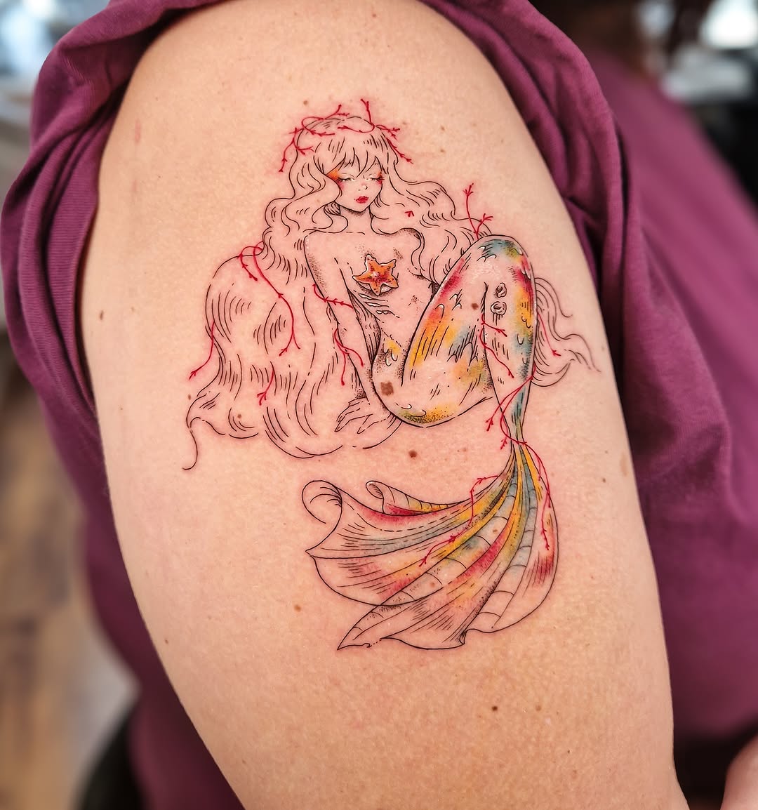 Whimsical watercolor mermaid tattoo design