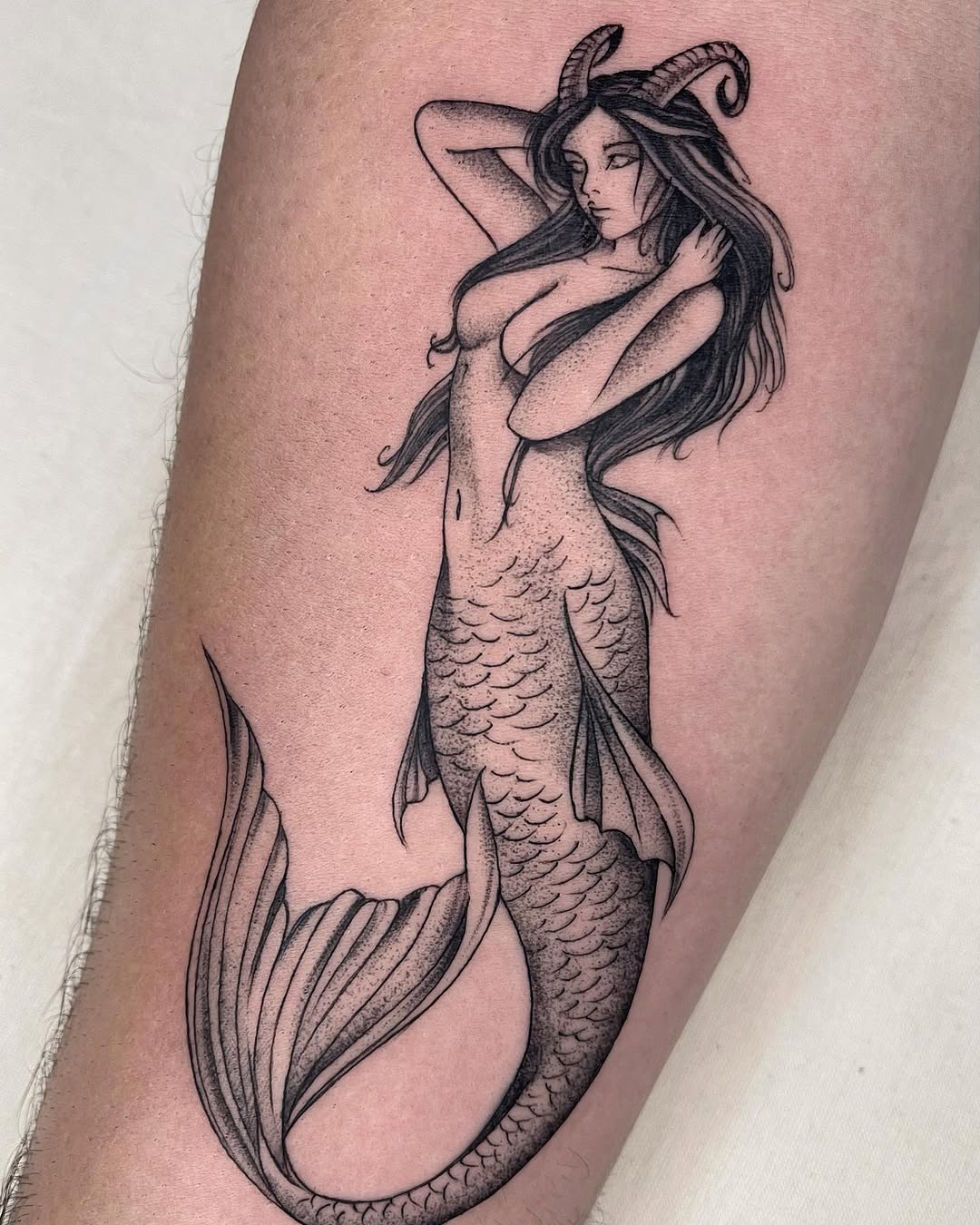 Stunning Mermaid Tattoo with Intricate Details