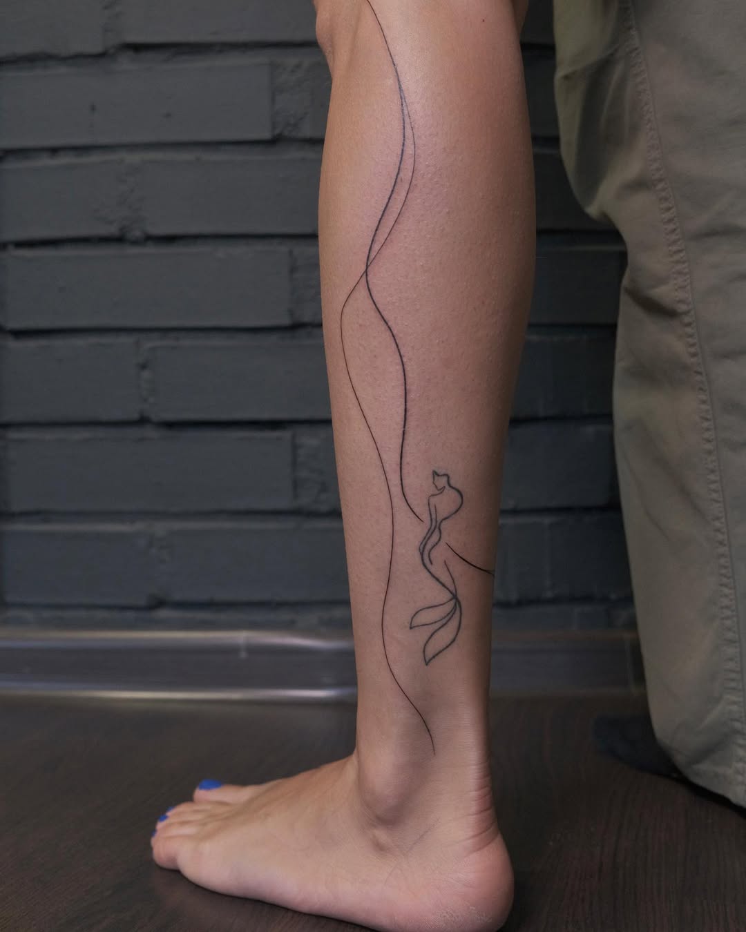 Elegant Line Art Mermaid Tattoo Design