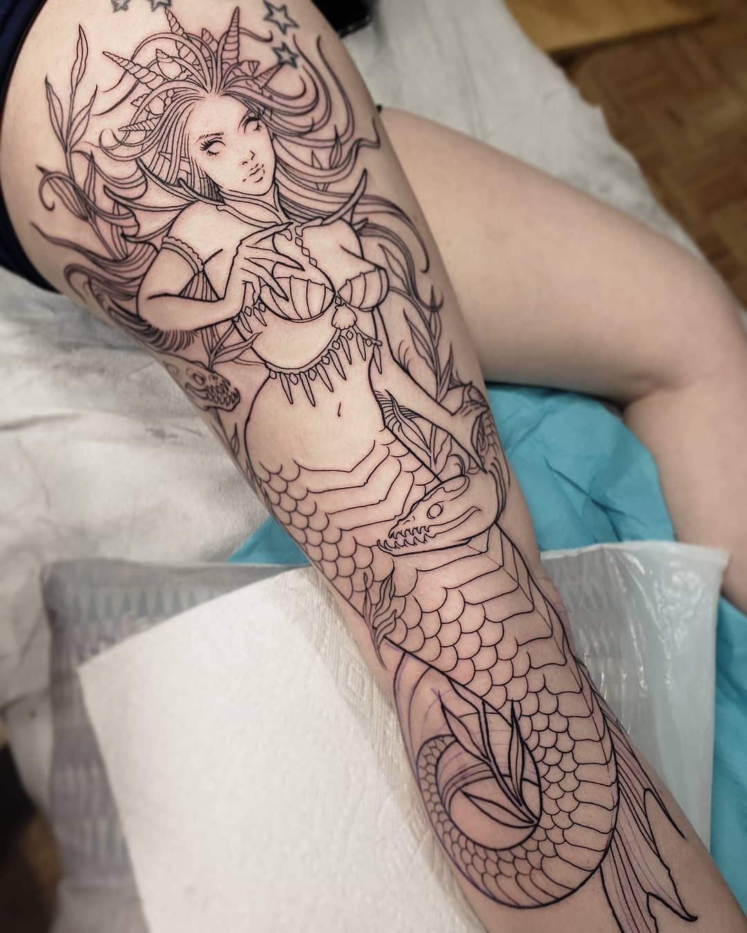 Stunning Mermaid Tattoo with Intricate Details