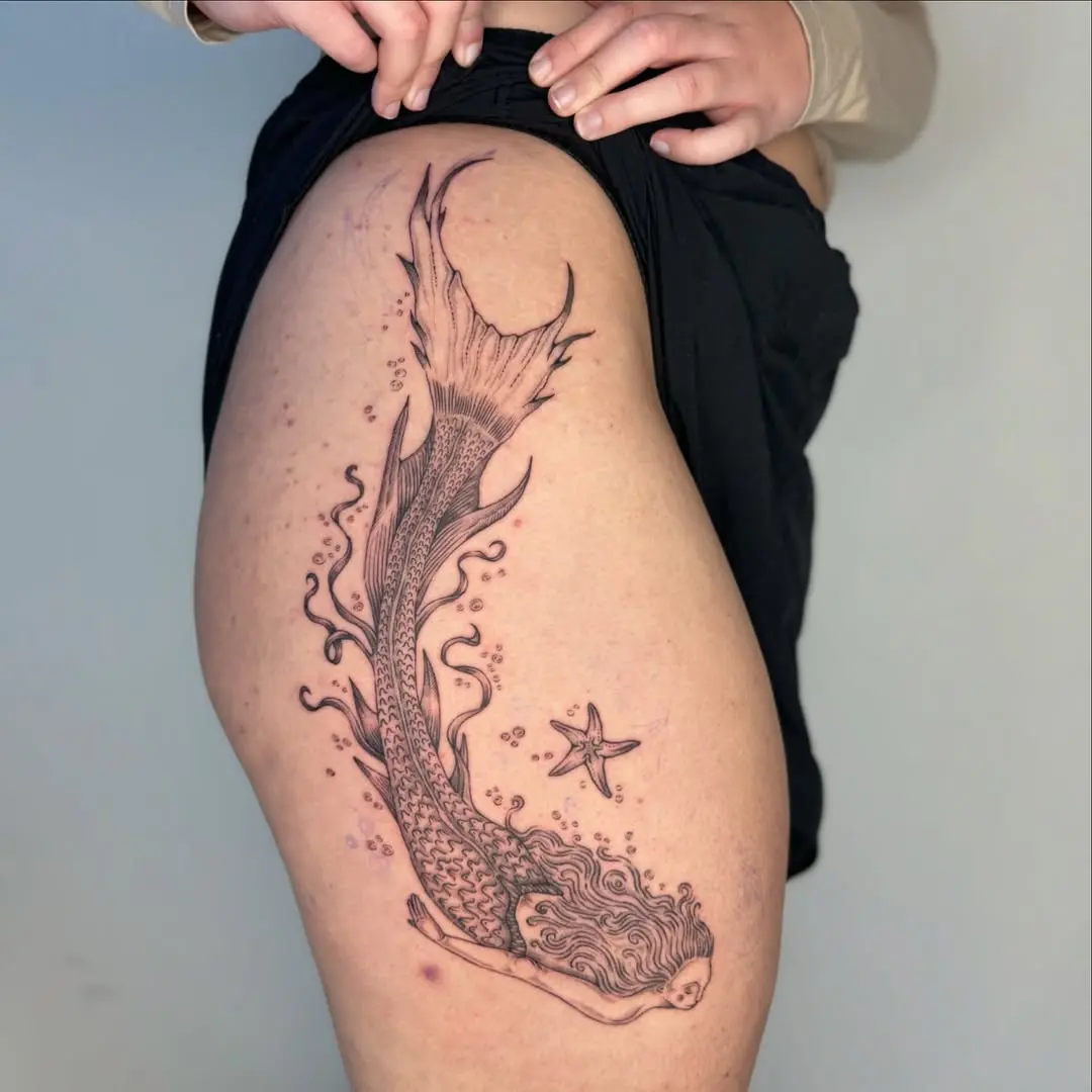 Stunning Mermaid Tattoo with Flowing Hair