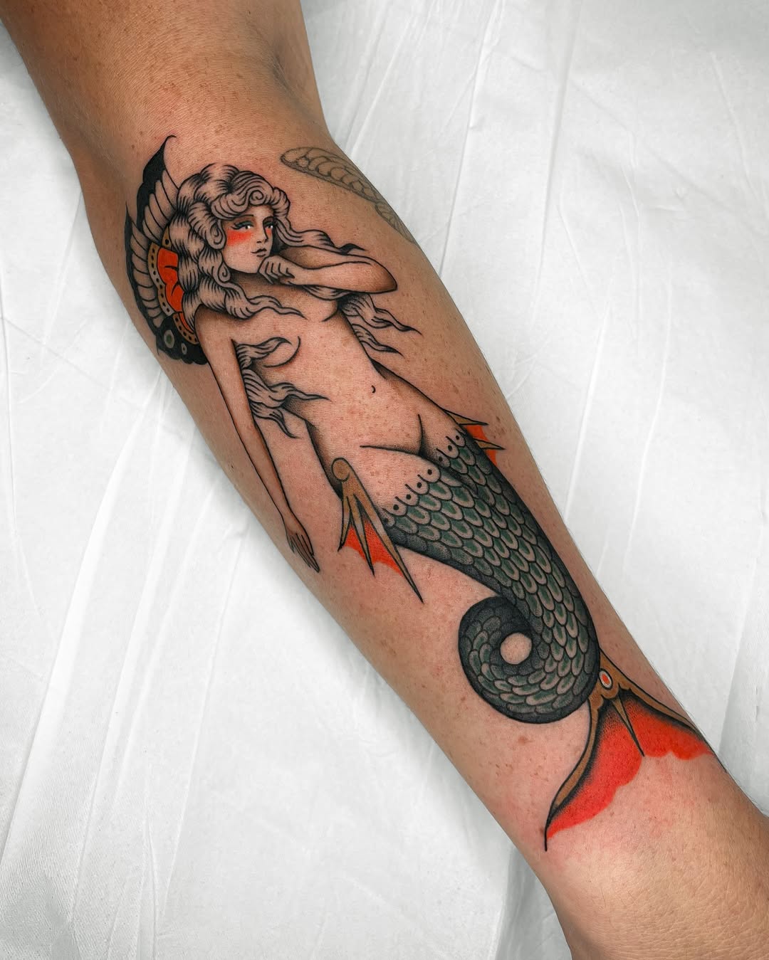 Stunning Mermaid Tattoo with Oceanic Elements