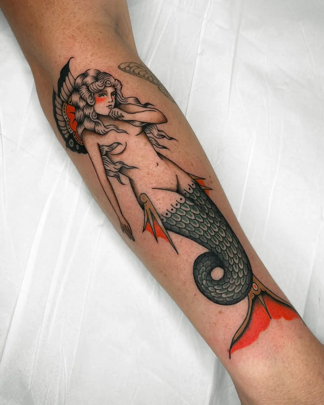 Stunning Mermaid Tattoo with Oceanic Elements