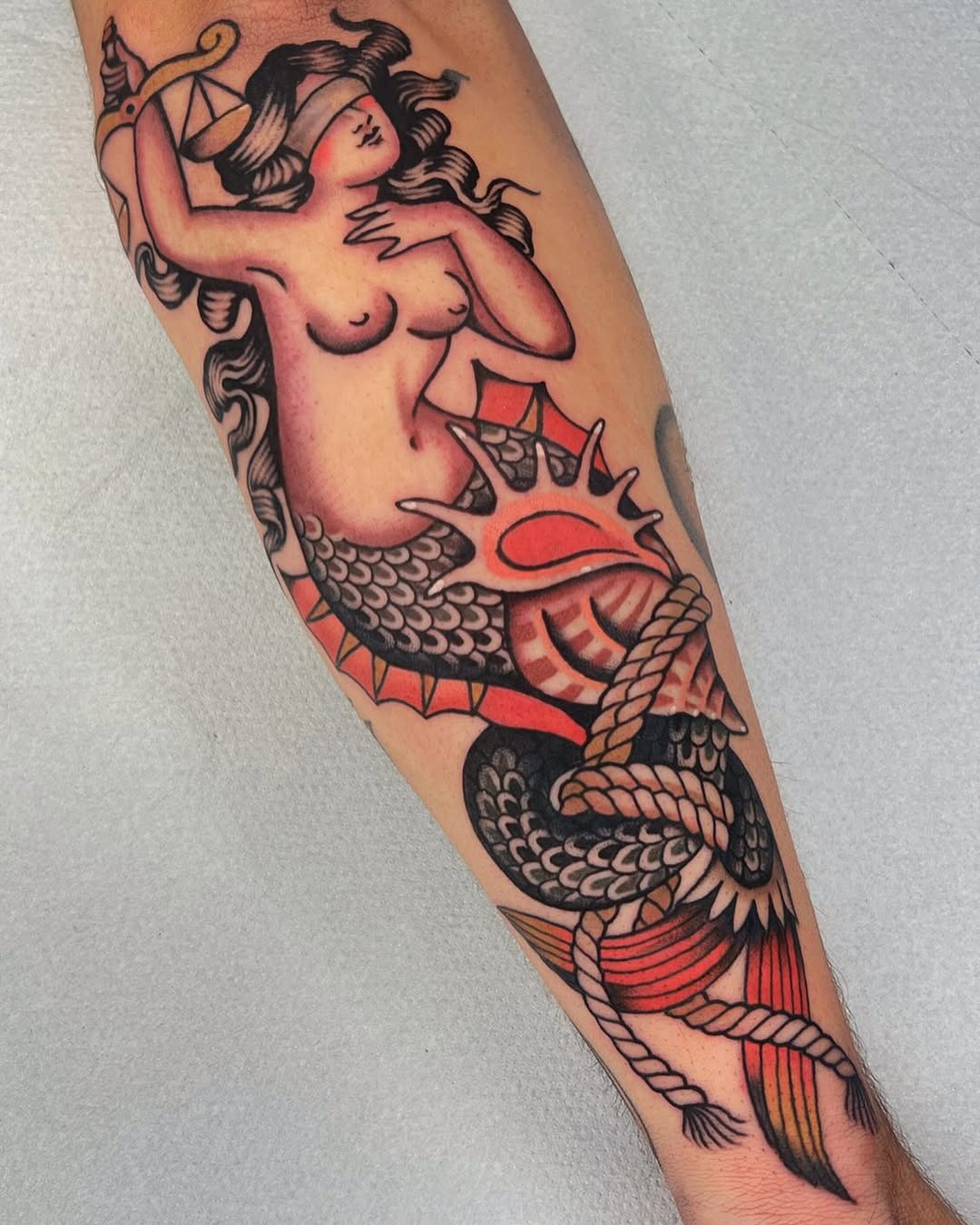 Stunning Mermaid Tattoo with Nautical Vibes