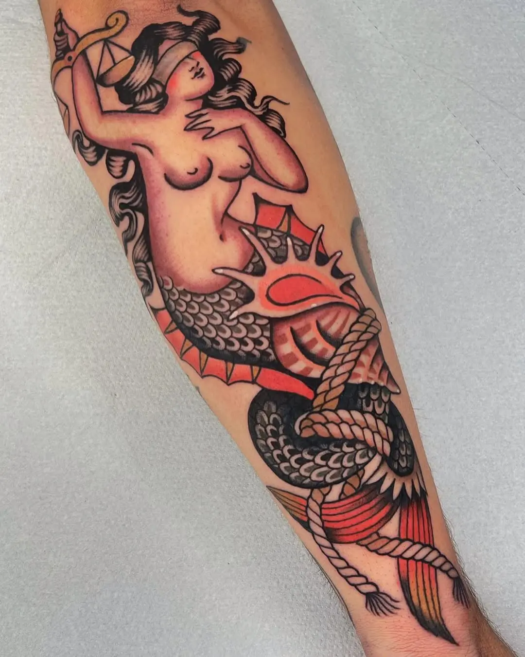 Stunning Mermaid Tattoo with Nautical Vibes
