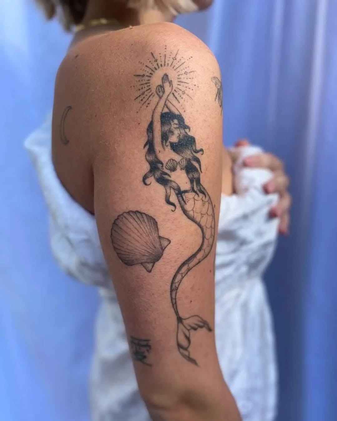 Elegant Mermaid Tattoo Embracing Ocean Vibes