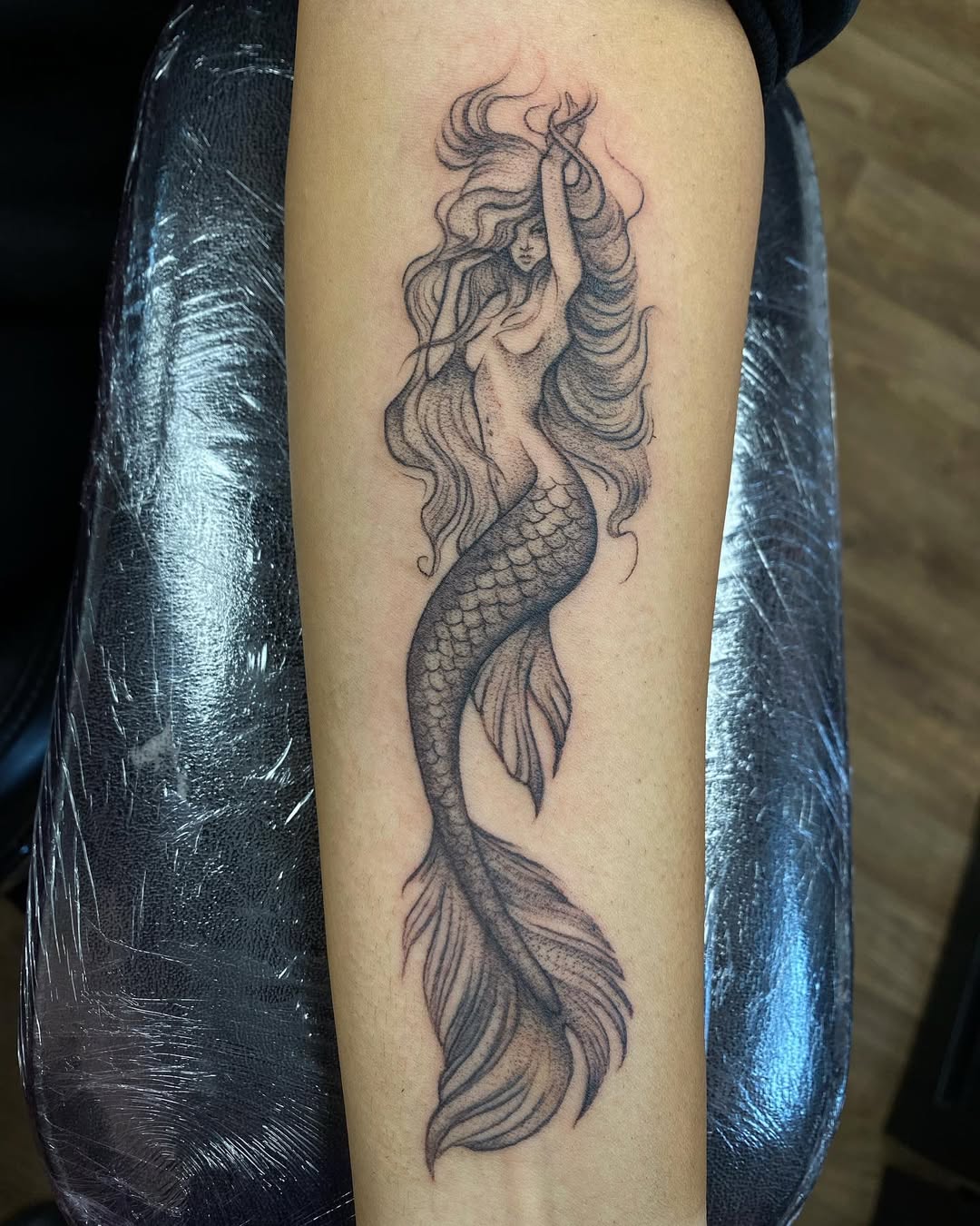 Elegant mermaid tattoo embracing ocean vibes