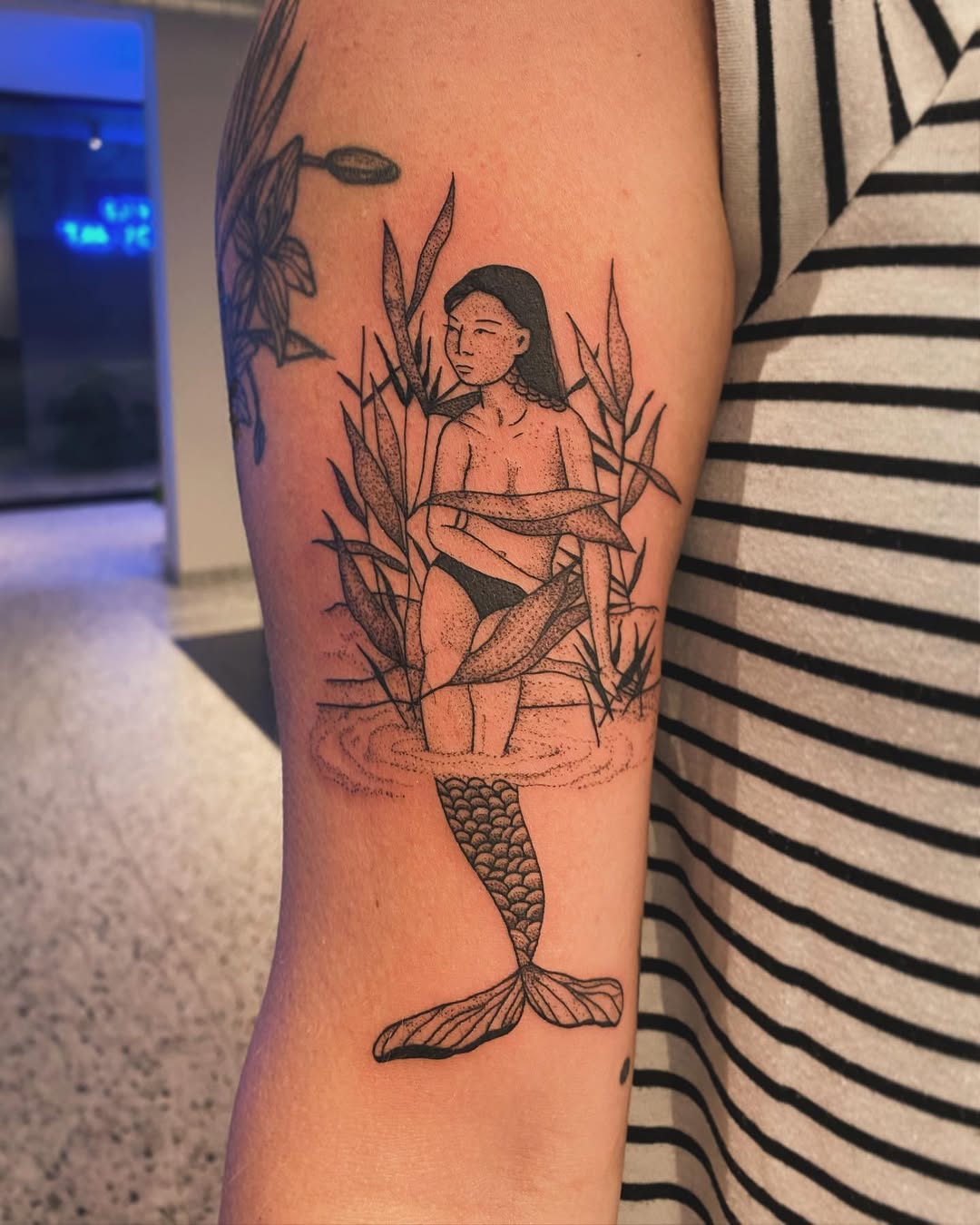 Unique Mermaid Tattoo Capturing Ocean Aesthetics