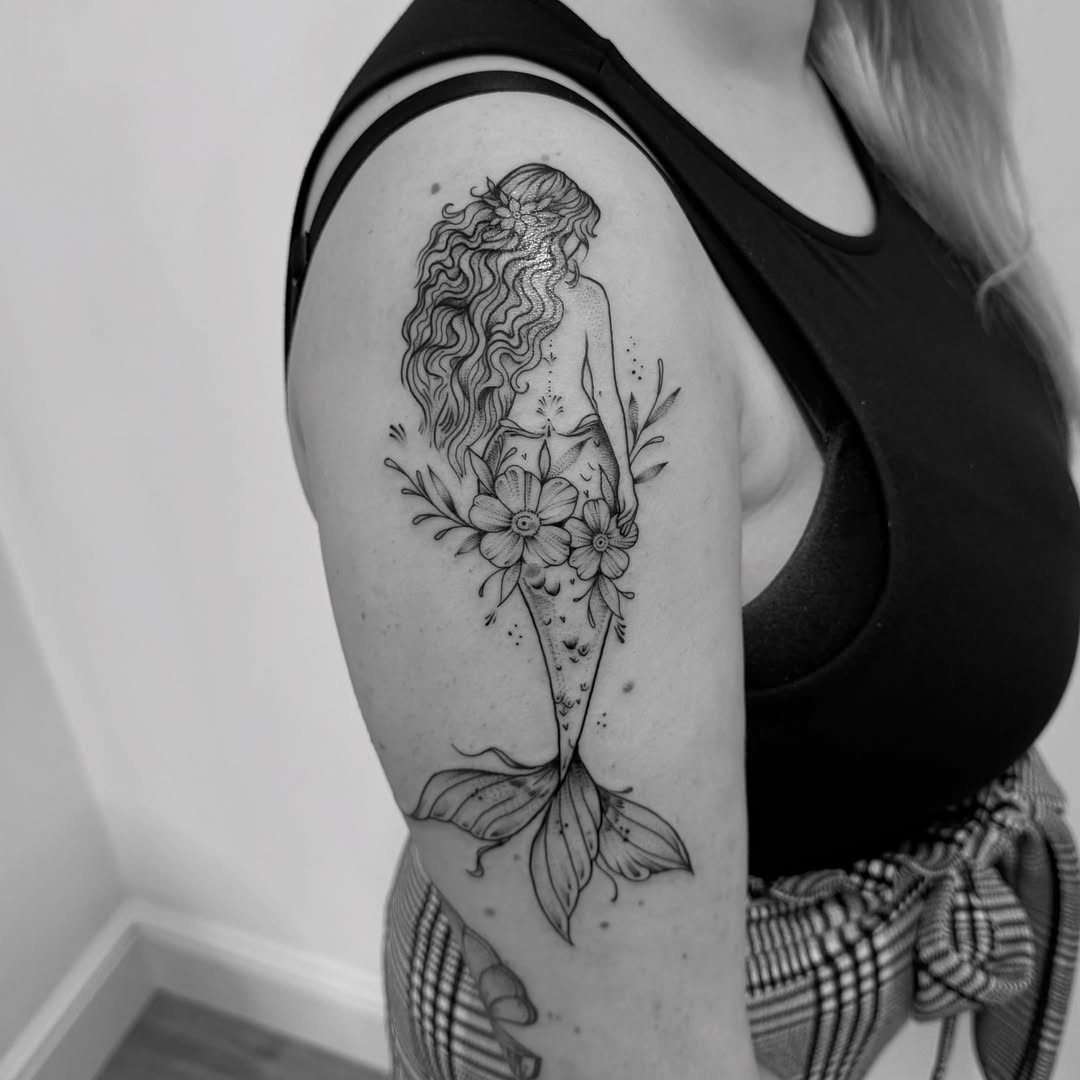 Elegant Mermaid Tattoo on Upper Arm