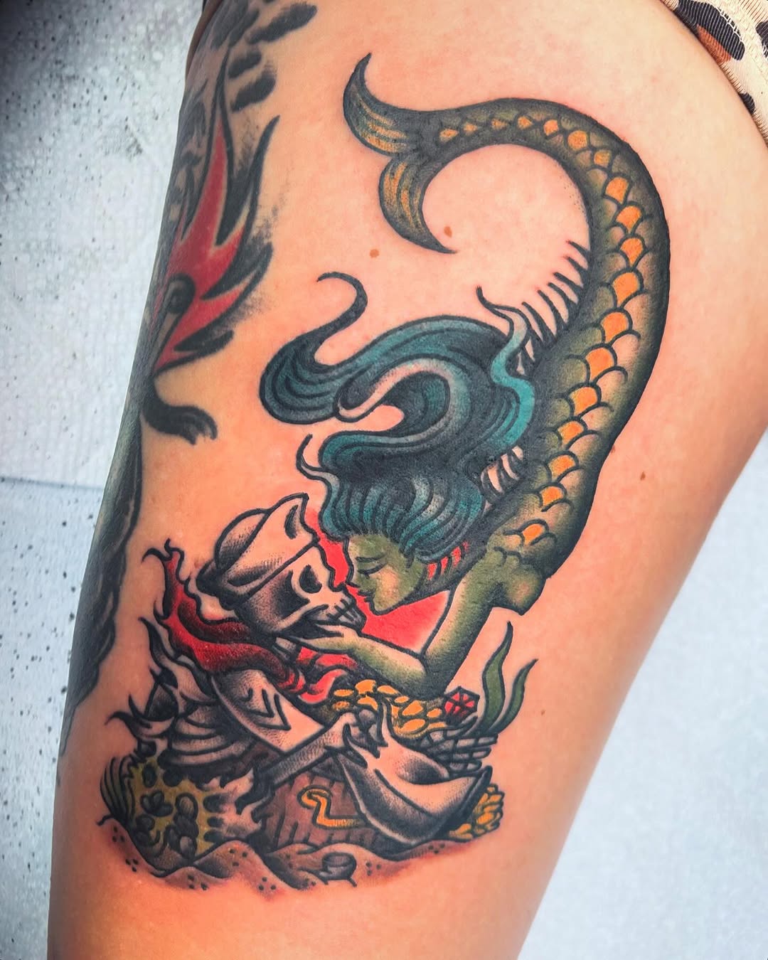 Vibrant Mermaid Tattoo with Nautical Elements