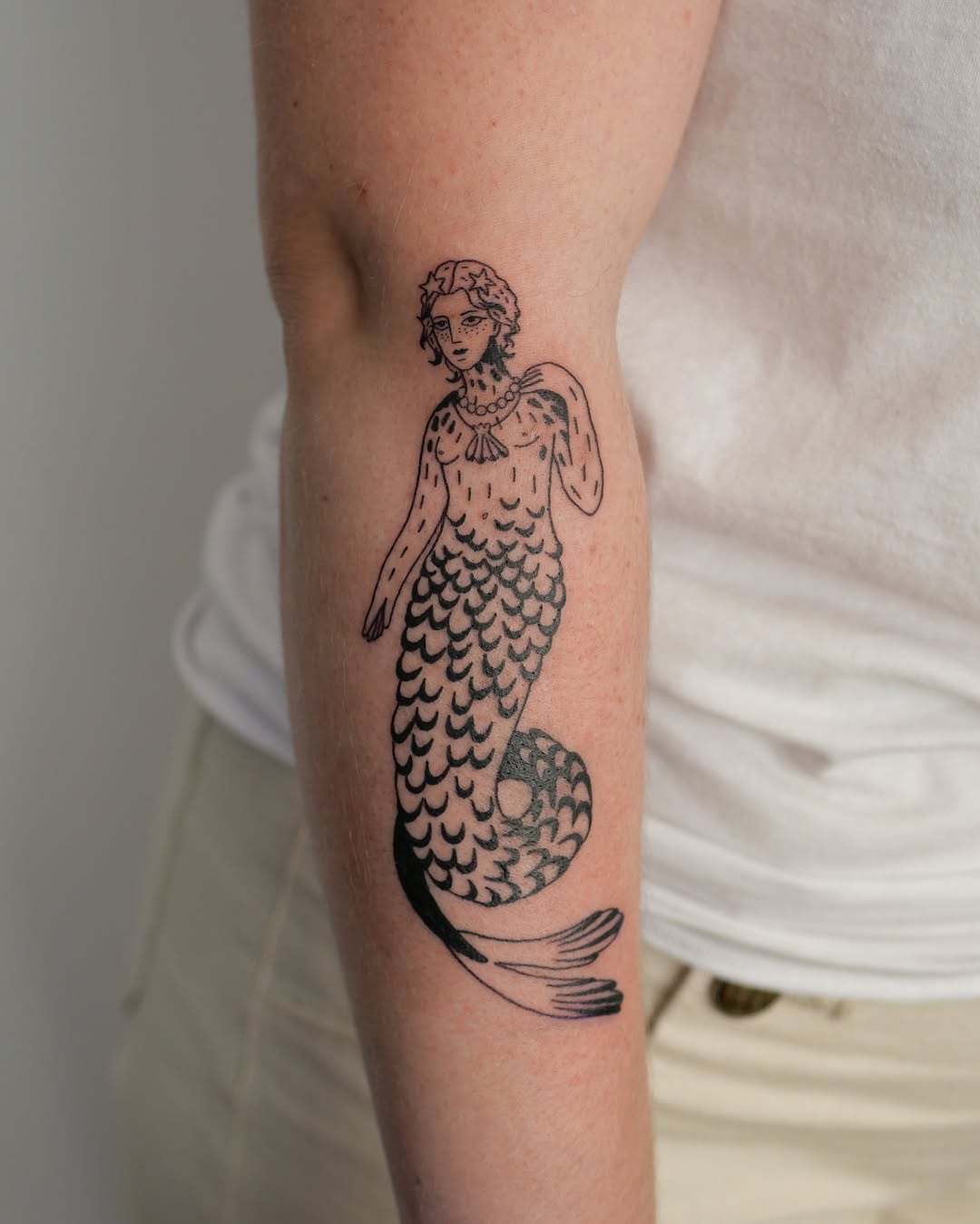 Elegant mermaid tattoo depicting mythical beauty