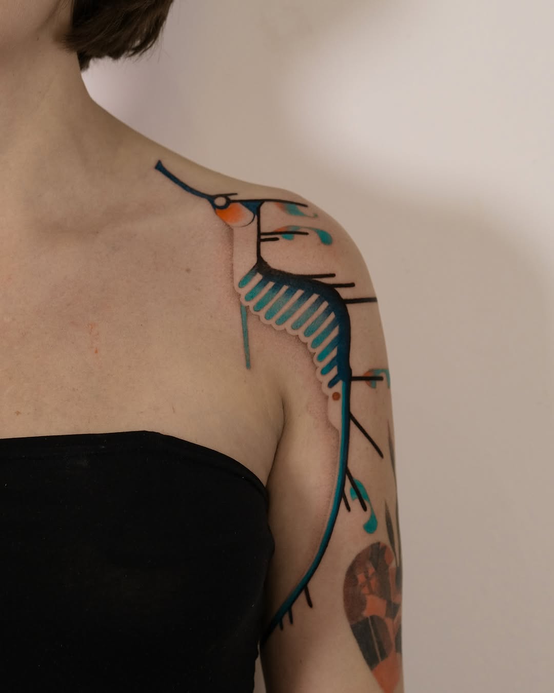 Elegant Mermaid Tattoo with Abstract Flair