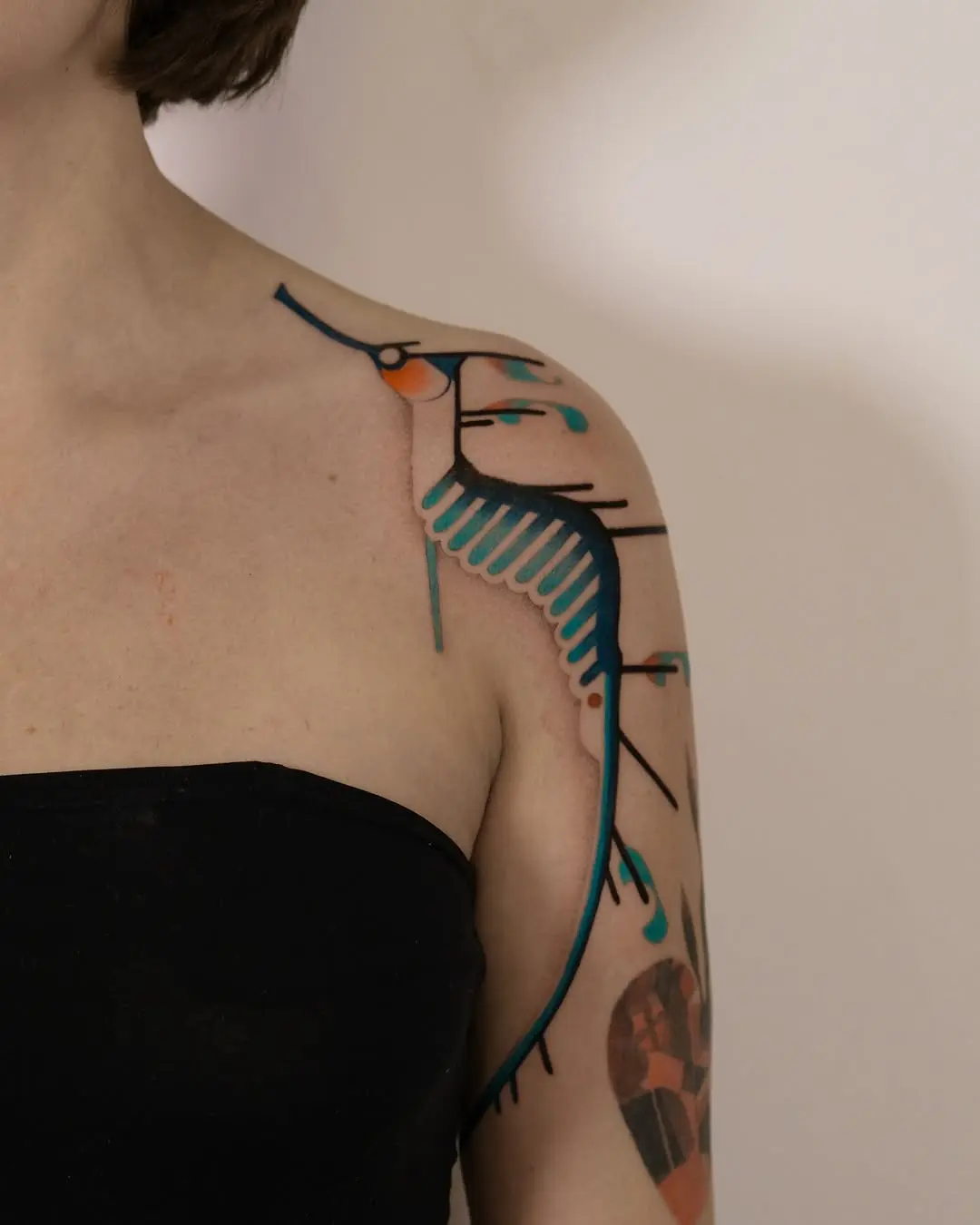 Elegant Mermaid Tattoo with Abstract Flair