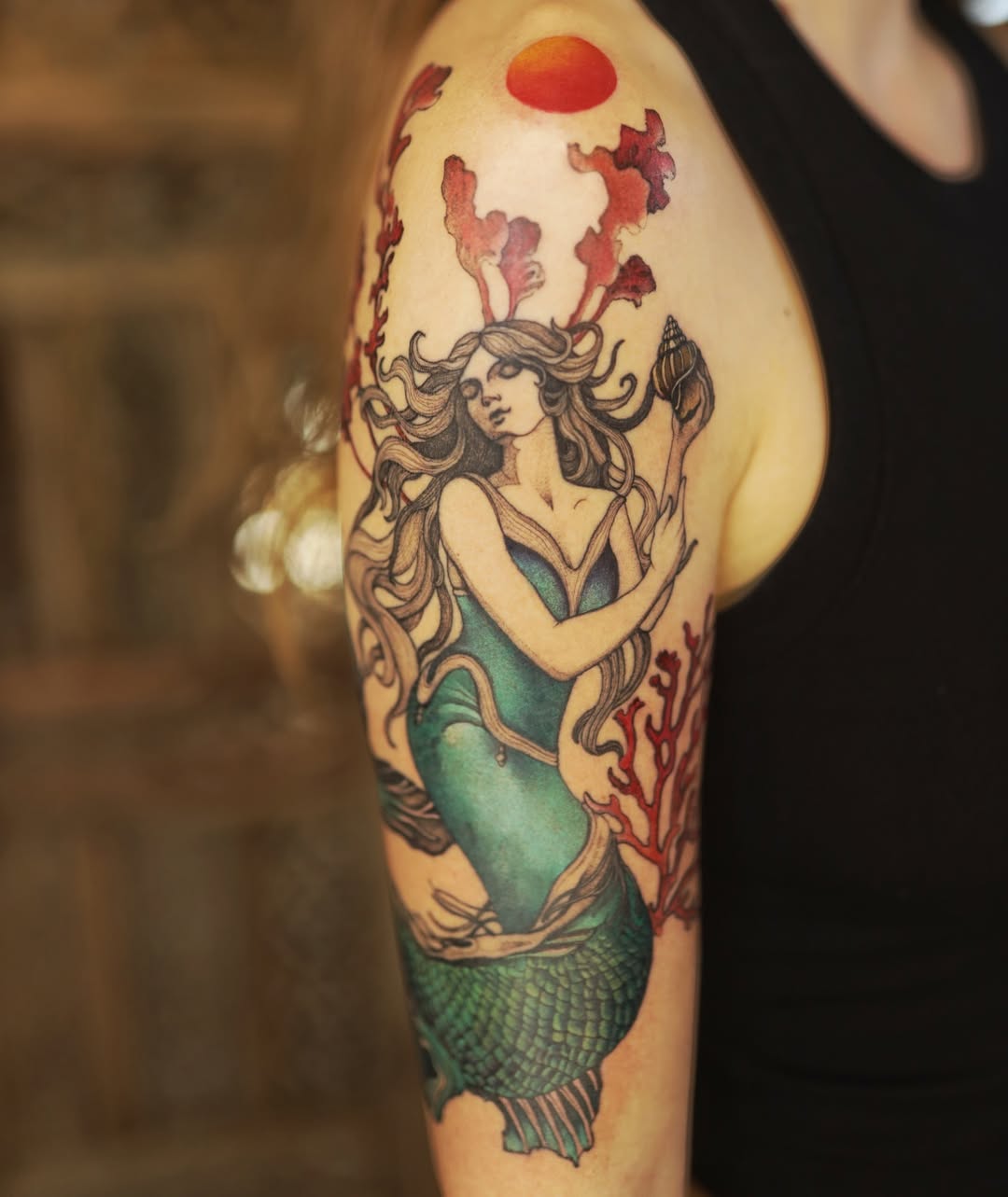 Stunning Mermaid Tattoo with Bold Colors