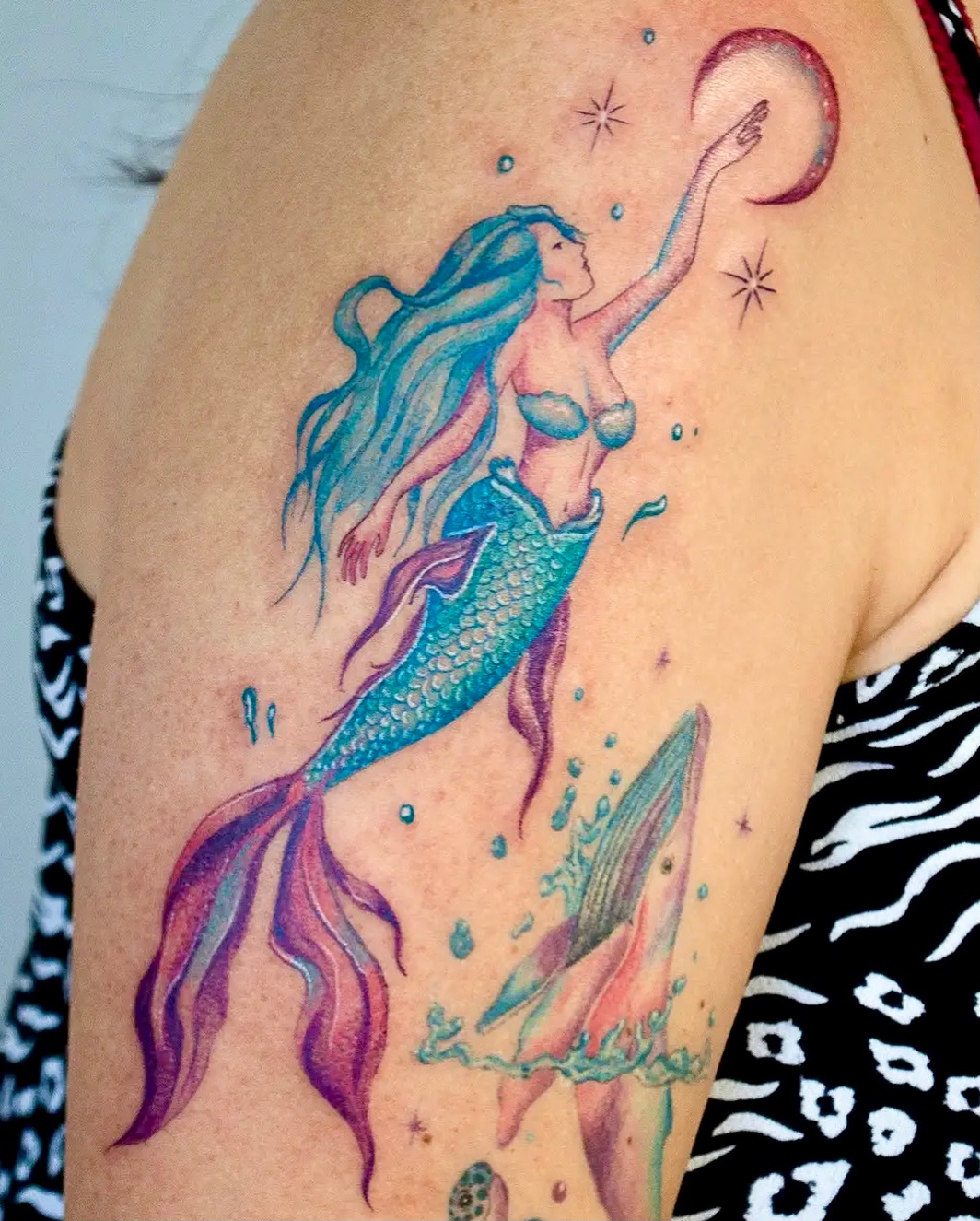 Enchanting mermaid tattoo in vibrant colors