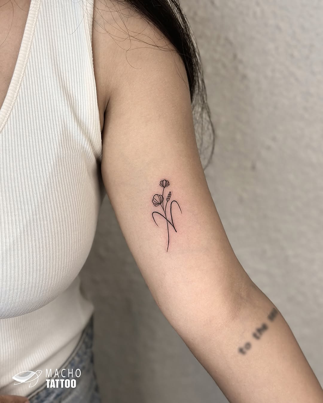 Elegant flower tattoo reflecting Aries vibes