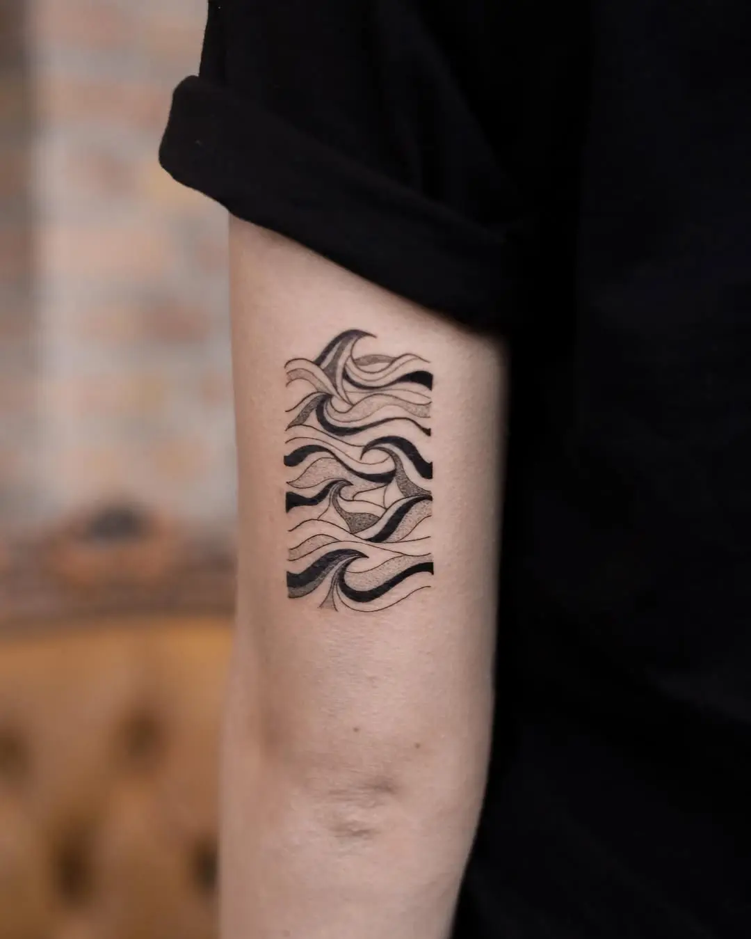 Flowing waves tattoo design for serene vibes