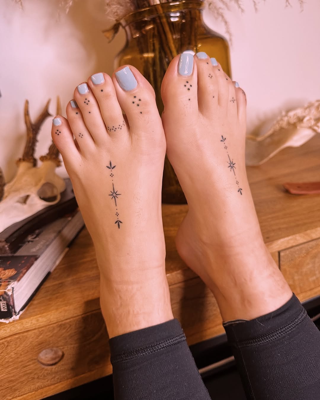 Ethereal Star-Themed Foot Tattoos