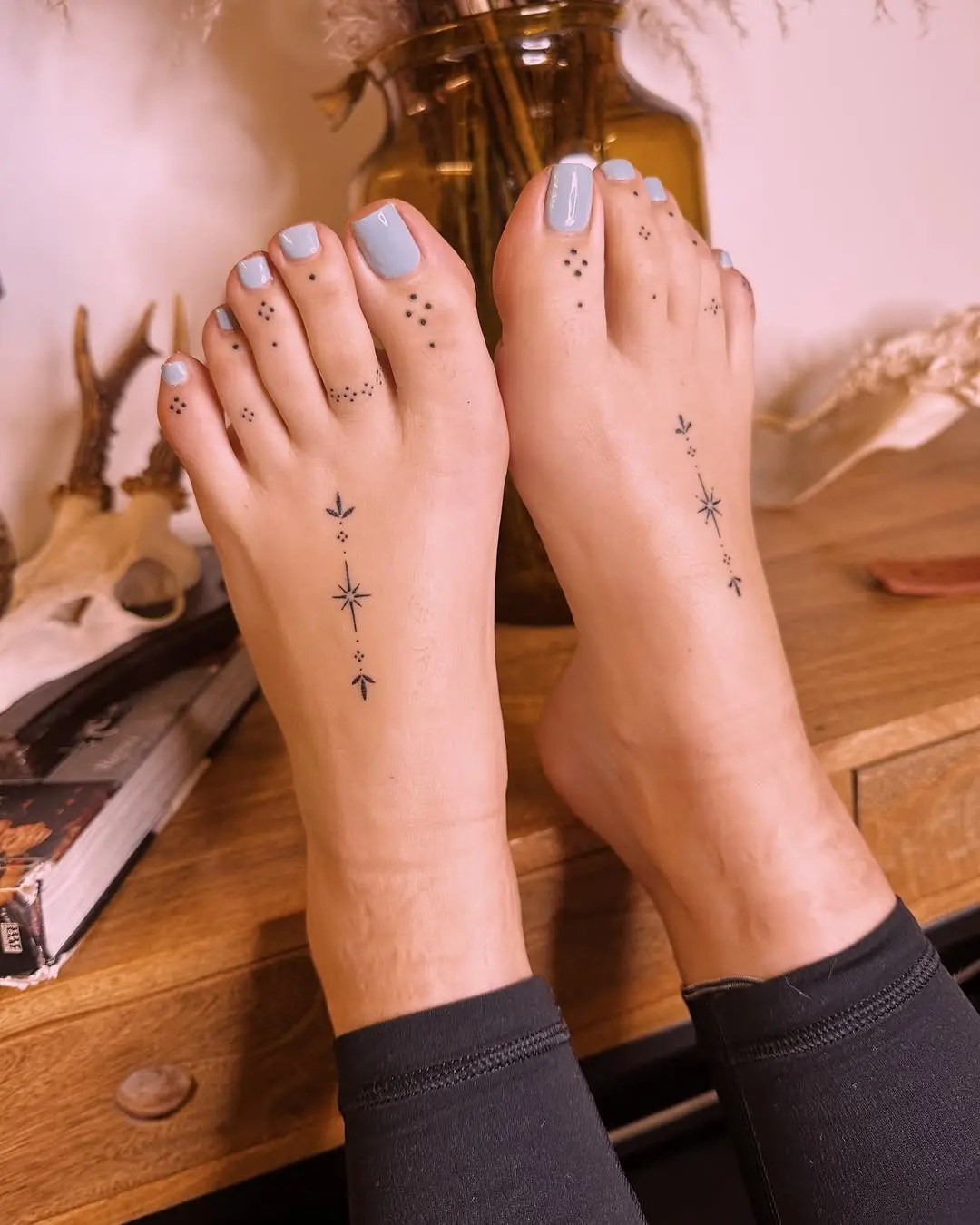 Ethereal Star-Themed Foot Tattoos