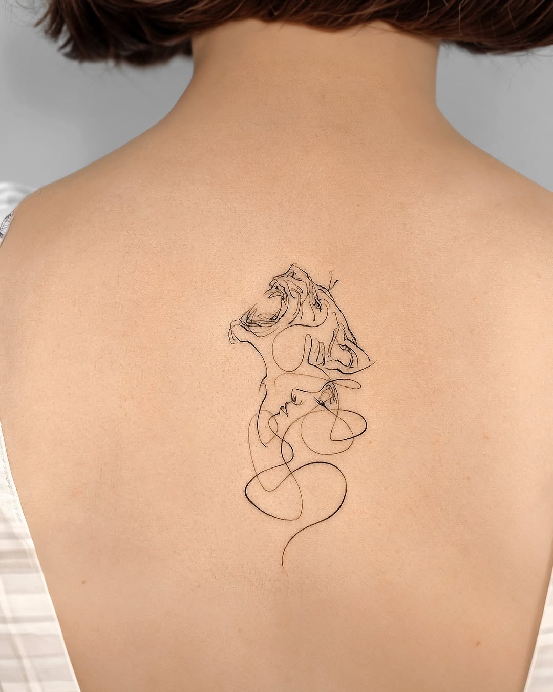 Elegant Lion Design on Woman's Back