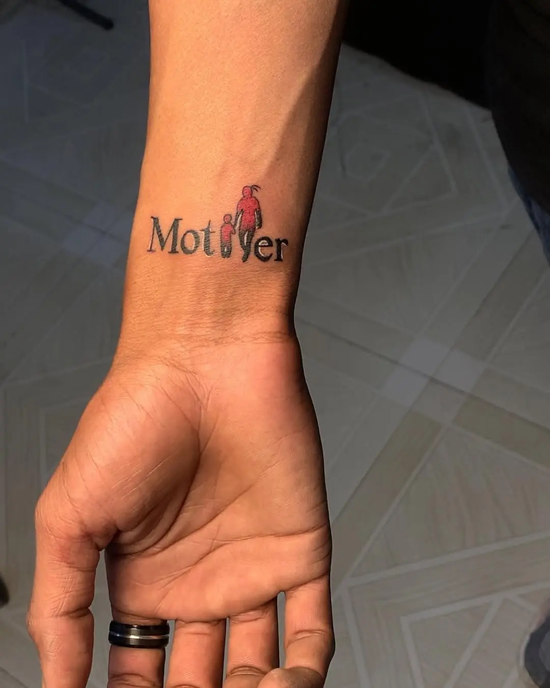 Elegant mother-themed small tattoo for women