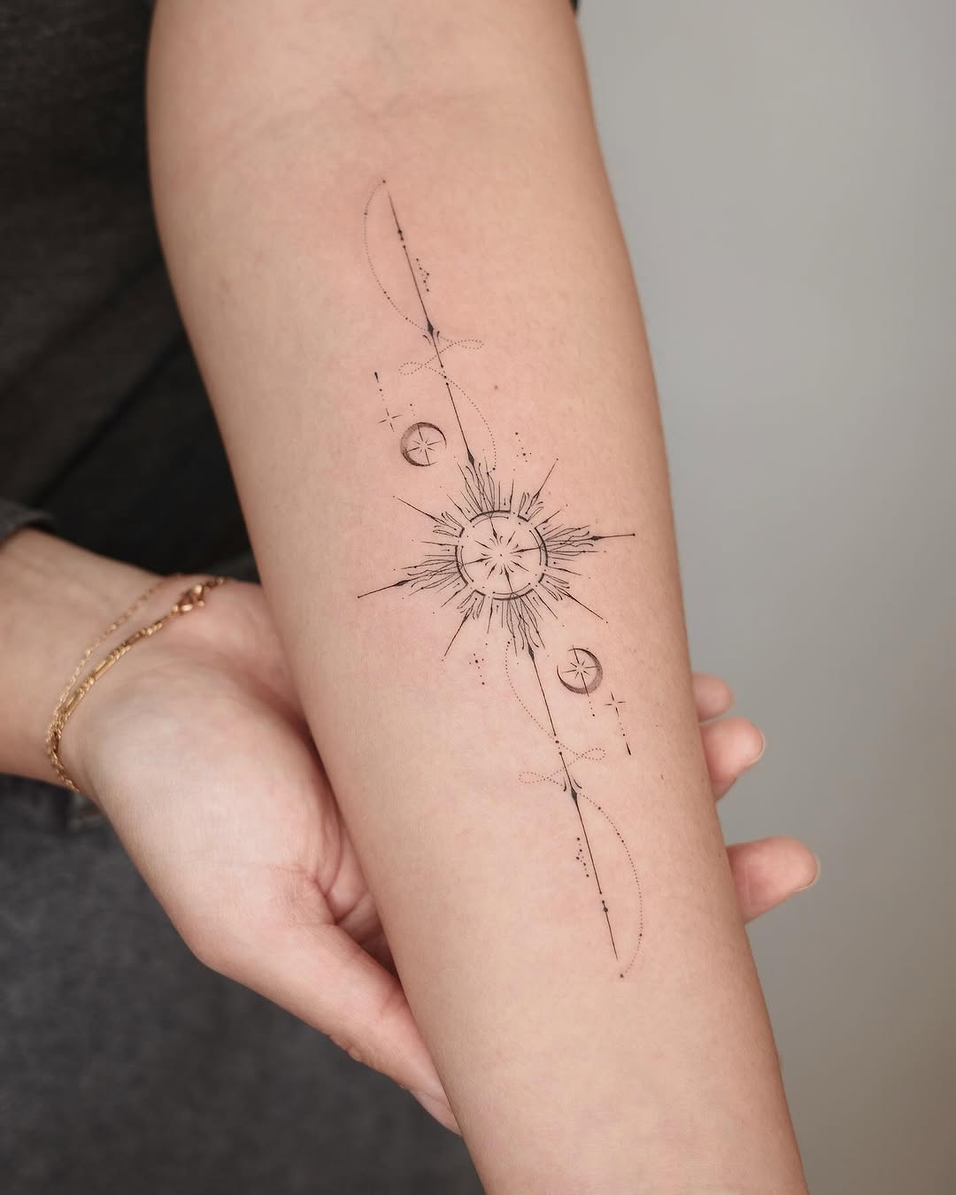 Elegant Sun Tattoo with Cosmic Elements