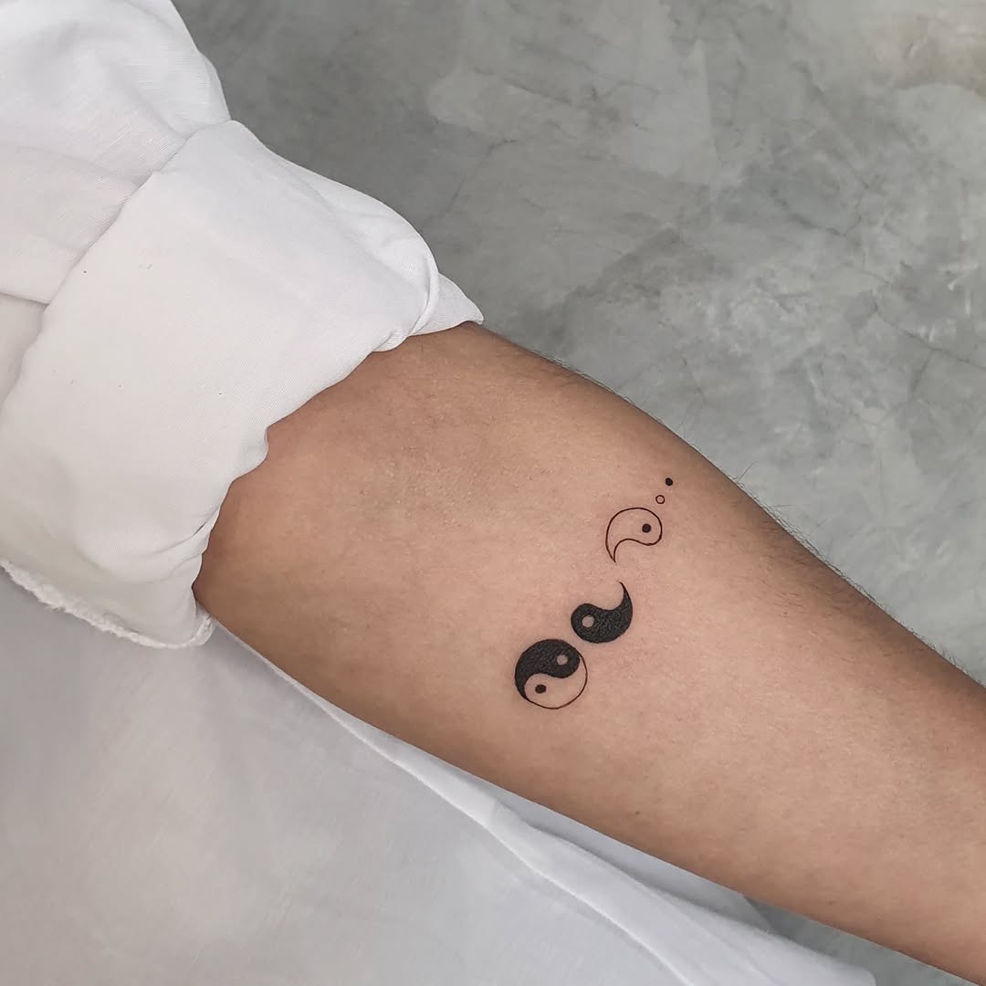 Minimalist Yin Yang Tattoo on Forearm