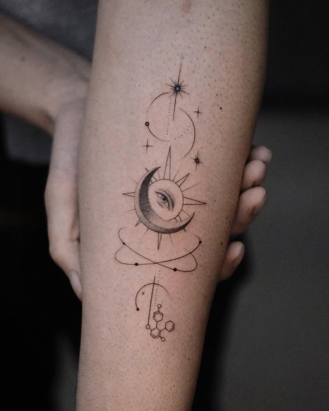 Cosmic sun and moon tattoo with intriguing design