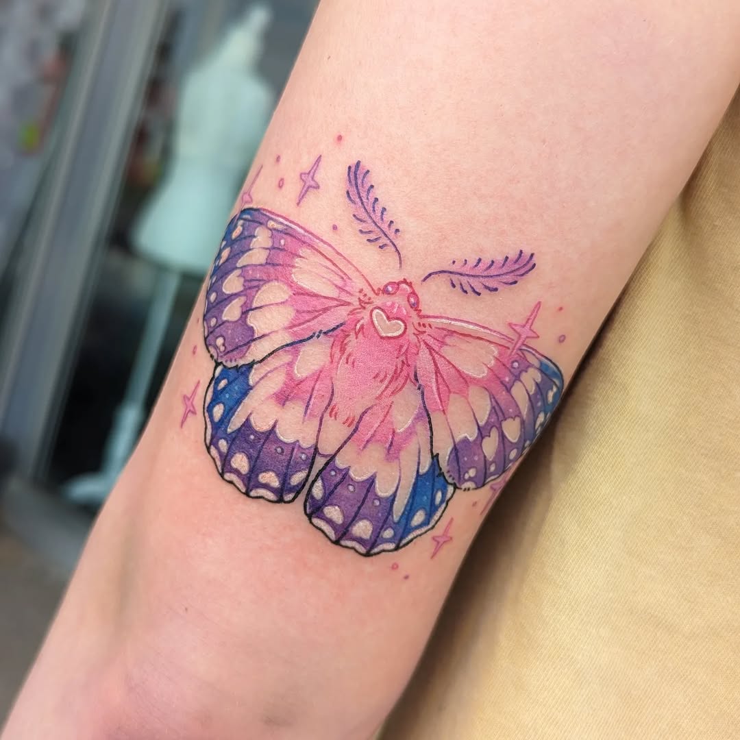 Colorful moth tattoo exuding whimsical charm