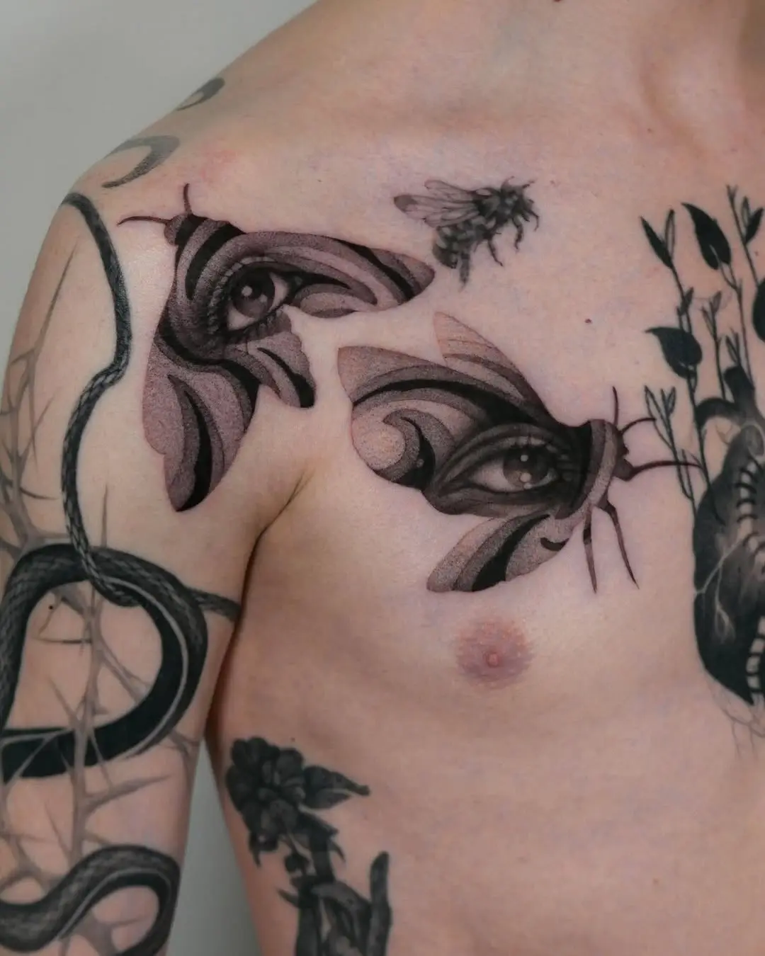 Intricate moth tattoo with intriguing eye details