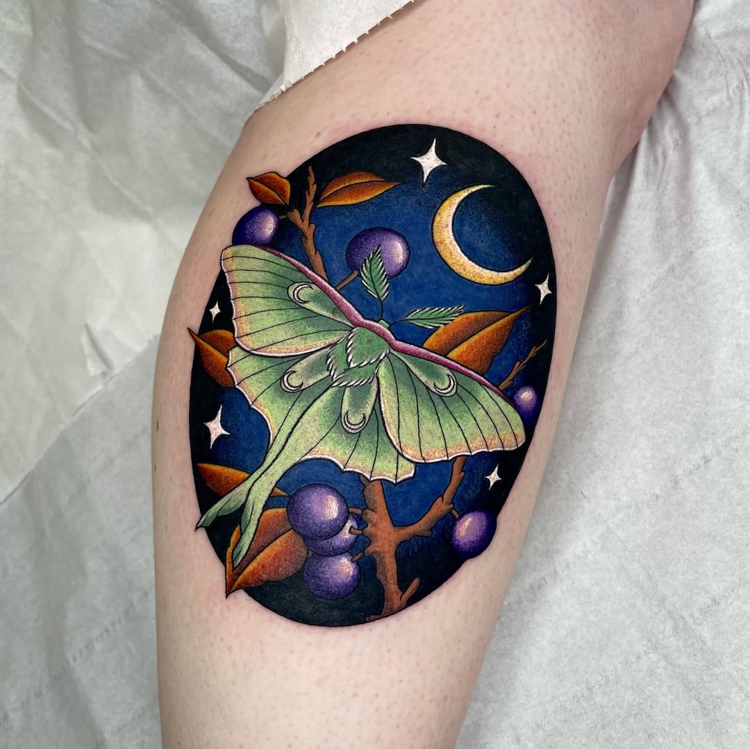 Elegant moth tattoo with moon and stars