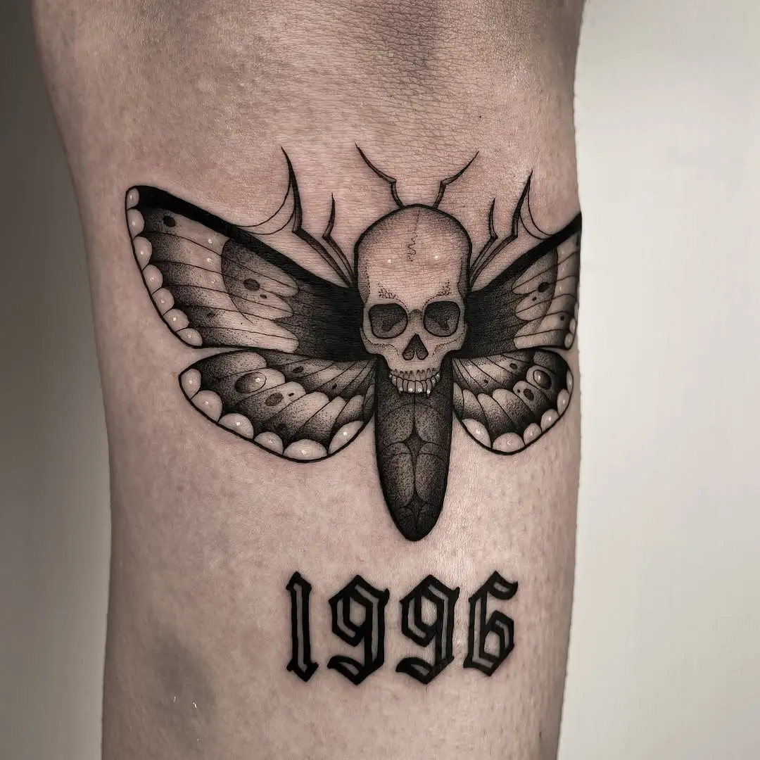 Unique moth tattoo with skull and year