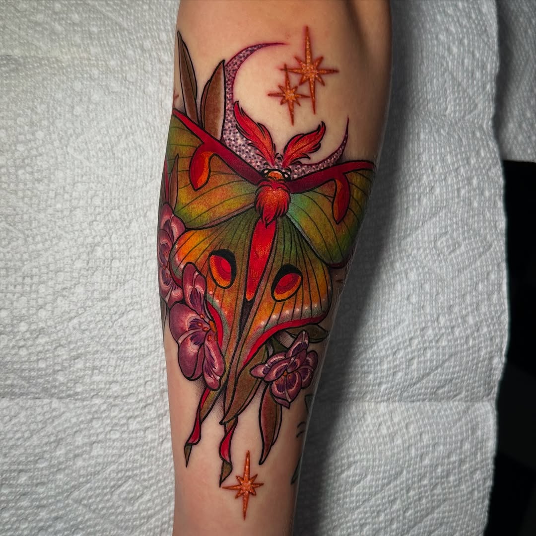 Stunning moth tattoo with floral accents
