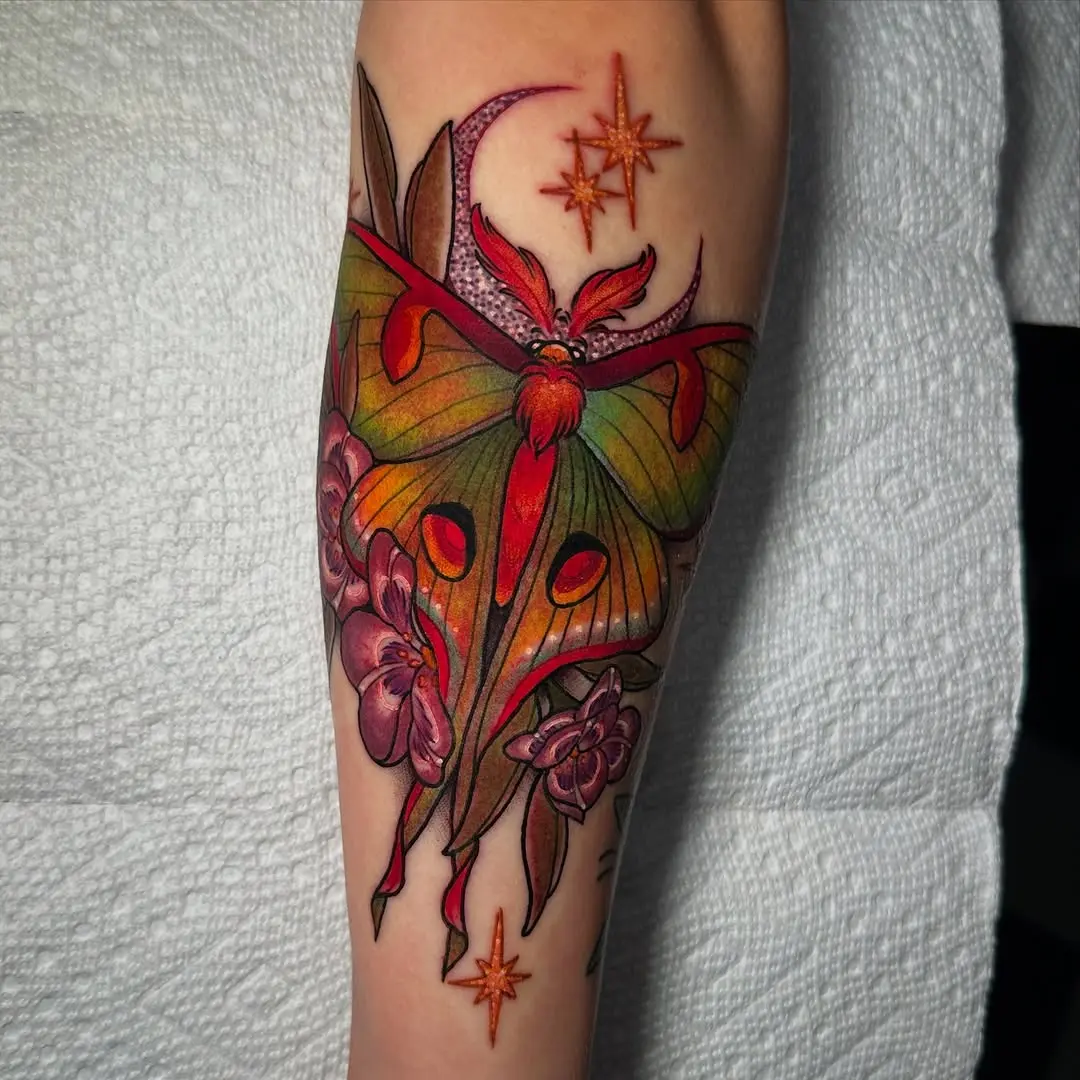 Stunning moth tattoo with floral accents