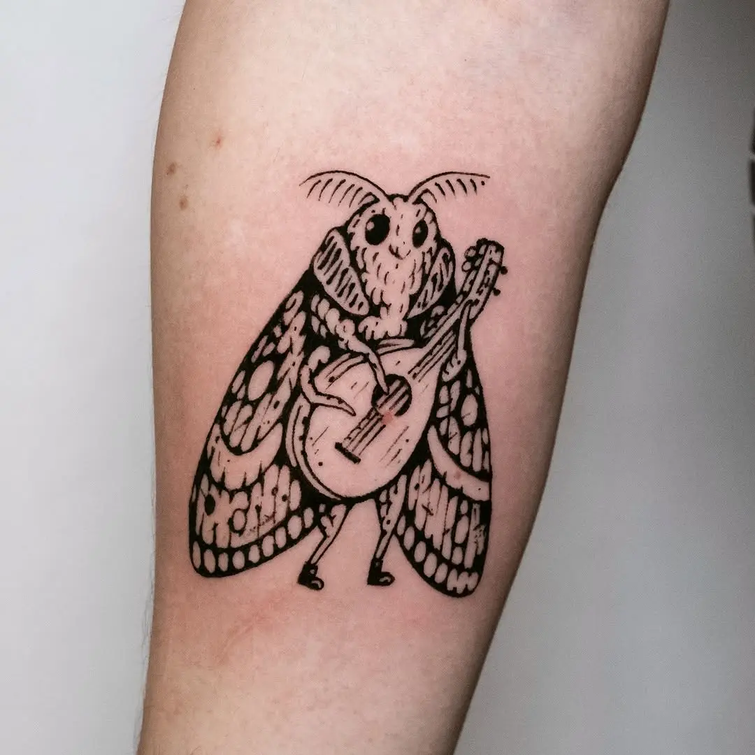 A charming moth playing a tiny guitar