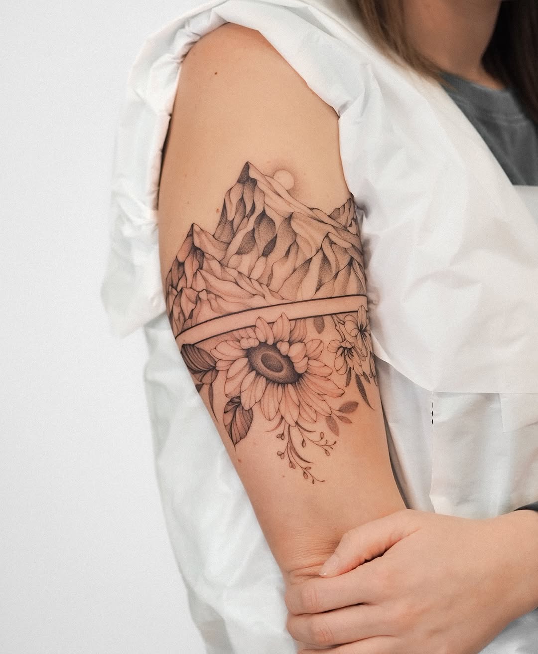 Stunning mountain and floral tattoo blend design