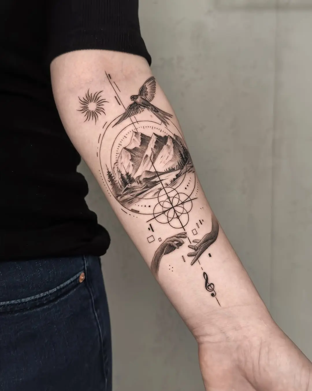 Stylish mountain tattoo with celestial elements