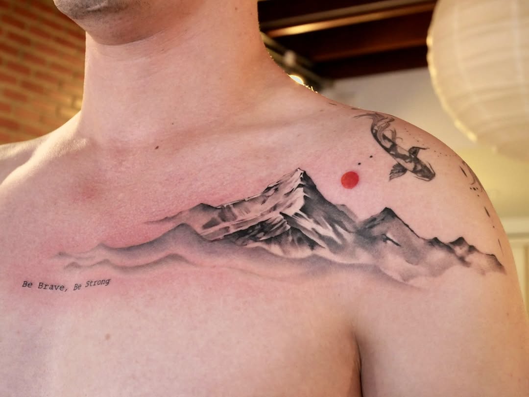 A stunning mountain tattoo with inspiring text.