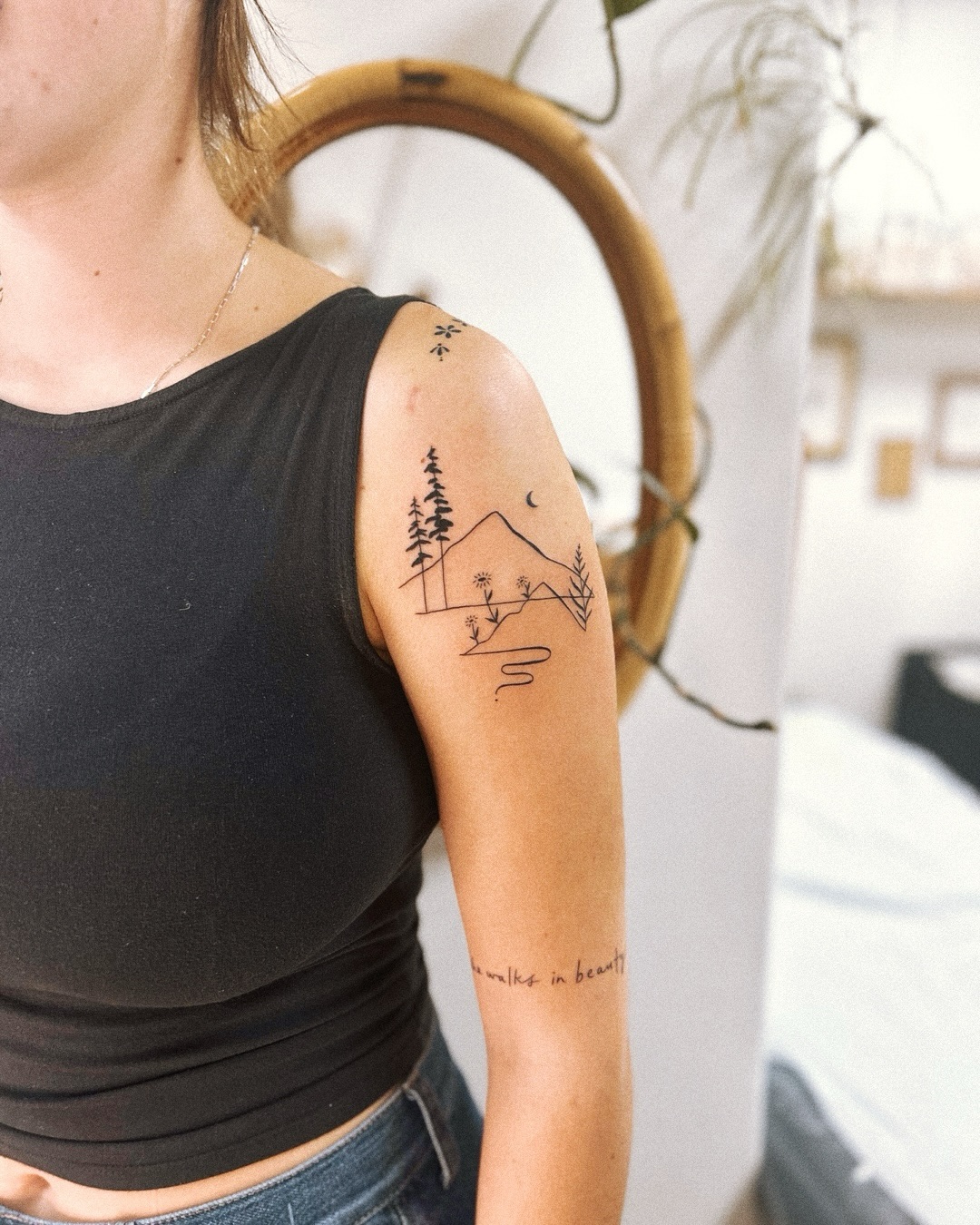 Nature-inspired tattoo showcasing serene mountain scenery