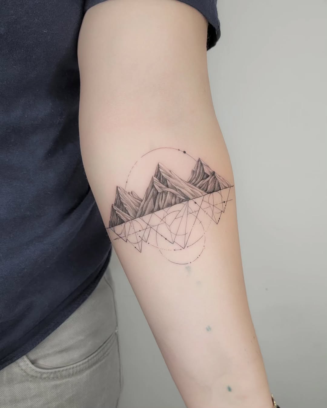 Stylish geometric mountain tattoo design