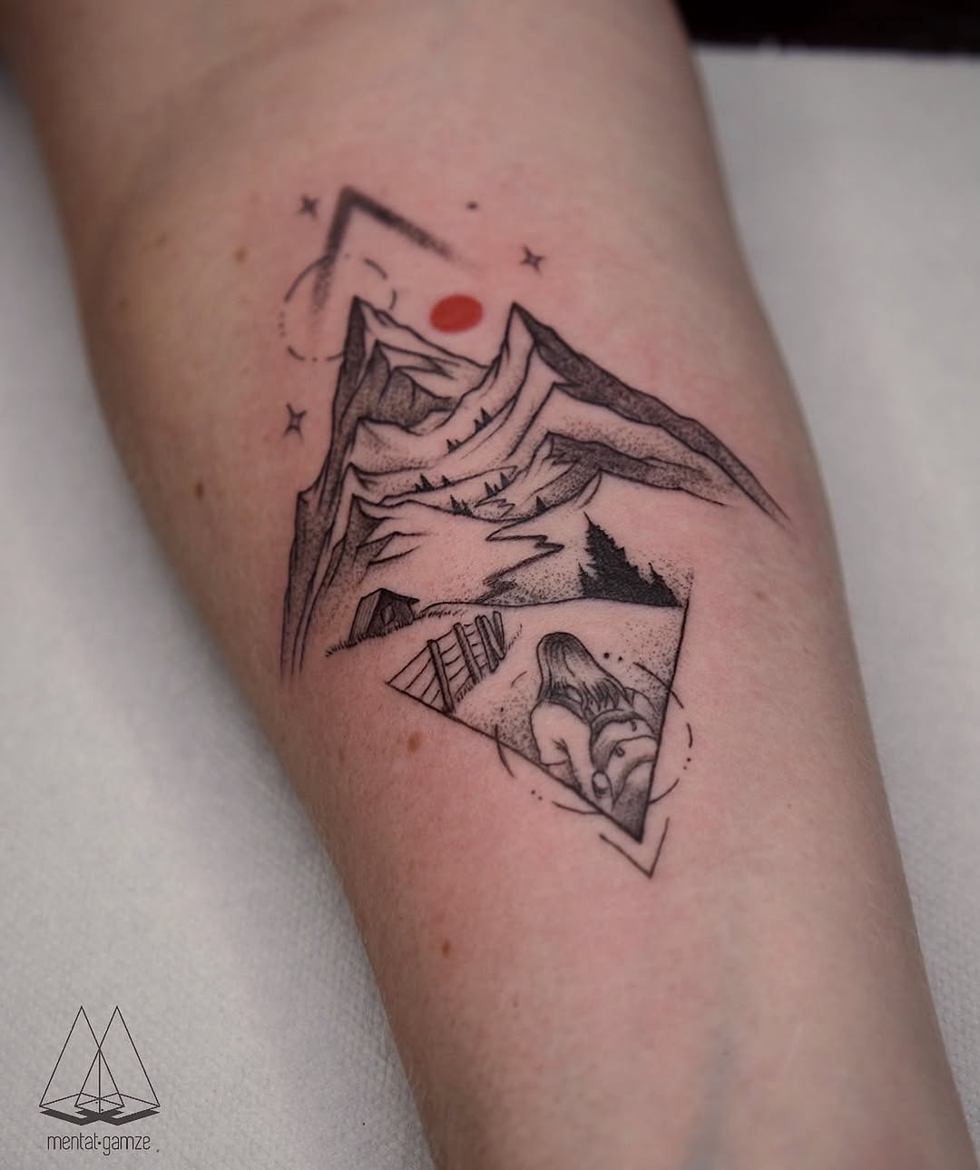 Intricate mountain tattoo with geometric design