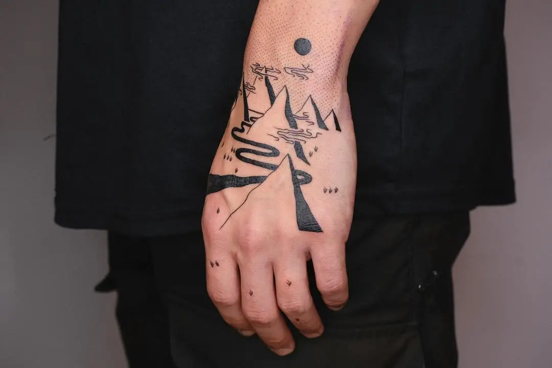Minimalist Mountain Range Hand Tattoo Design