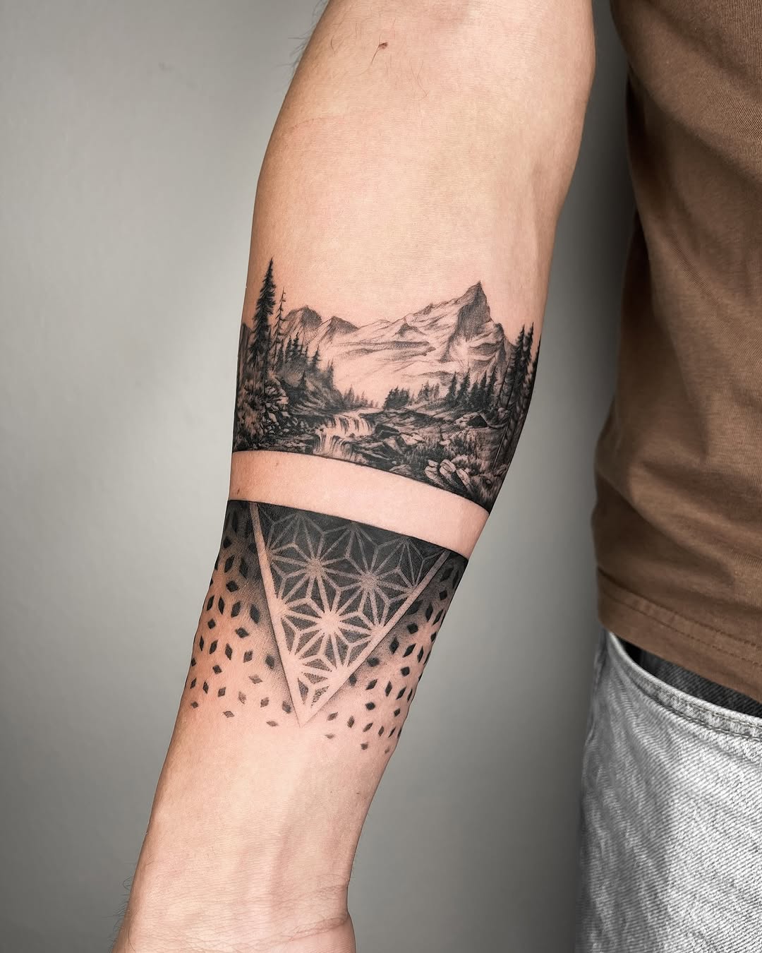 Stunning mountain landscape tattoo with geometric design