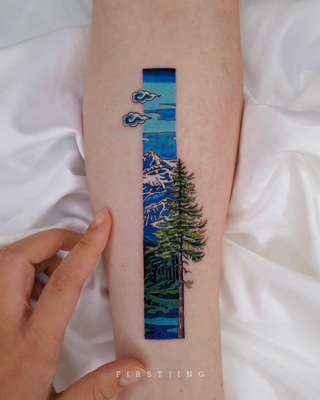 A stunning mountain scenery tattoo on the arm