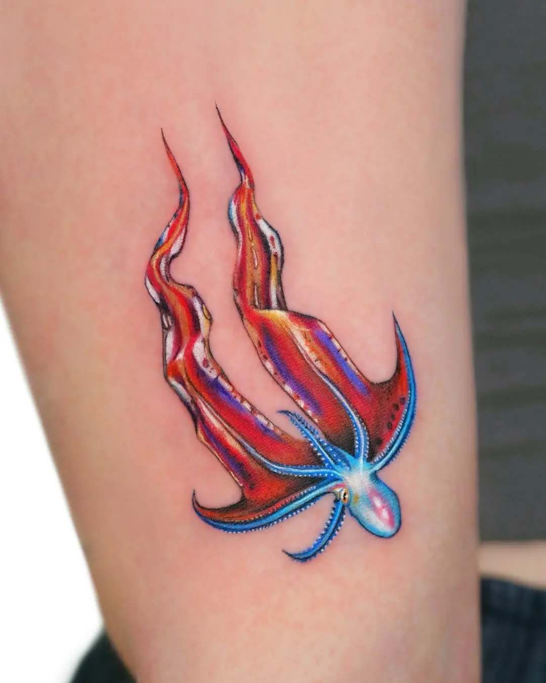 Dynamic octopus tattoo showcasing vibrant colors