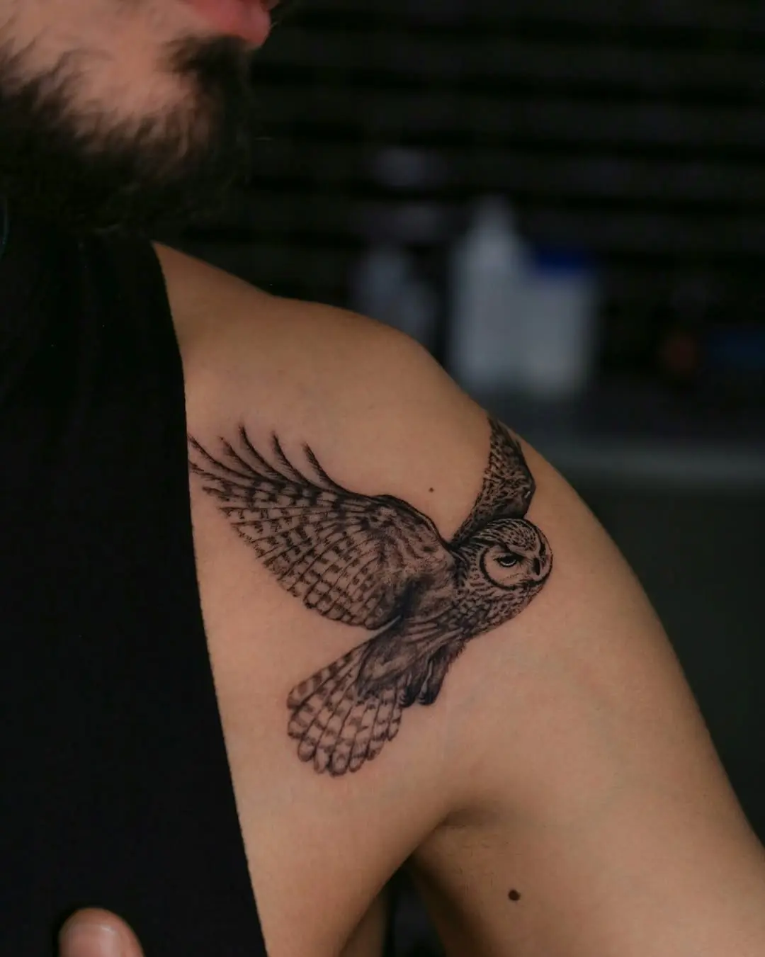 Intricate owl tattoo on shoulder display