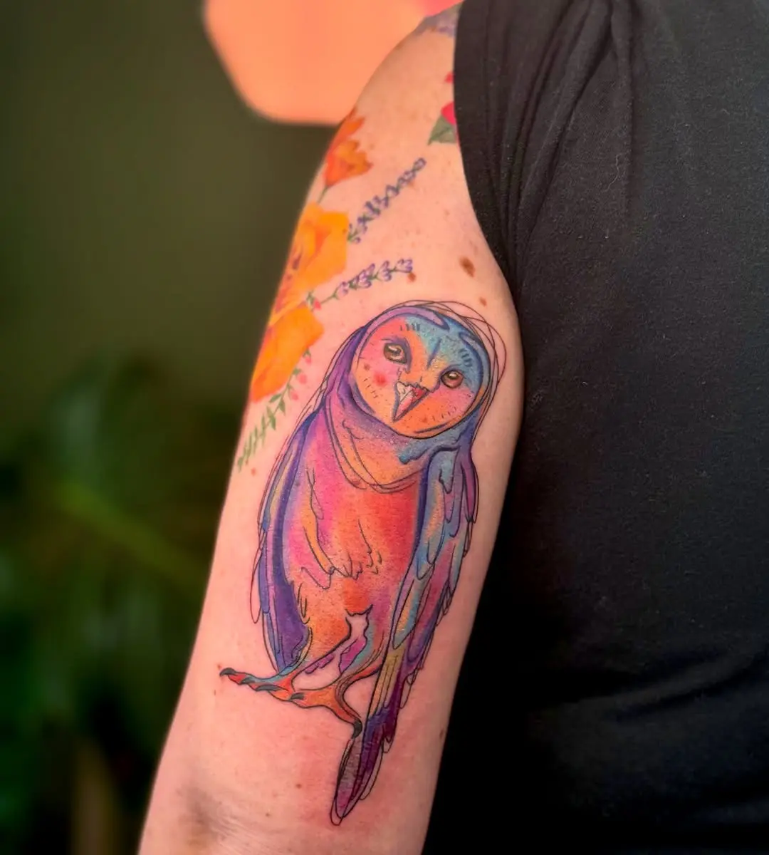 A vibrant and artistic owl tattoo design
