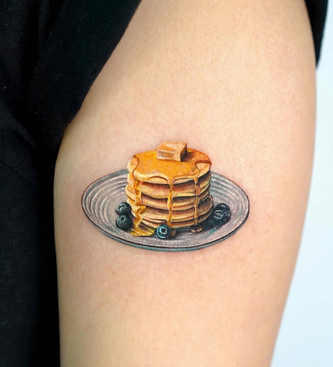 Delicious pancake tattoo with blueberry accents